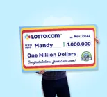 Winner Mandy holds a check for $1,000,000 in her hands